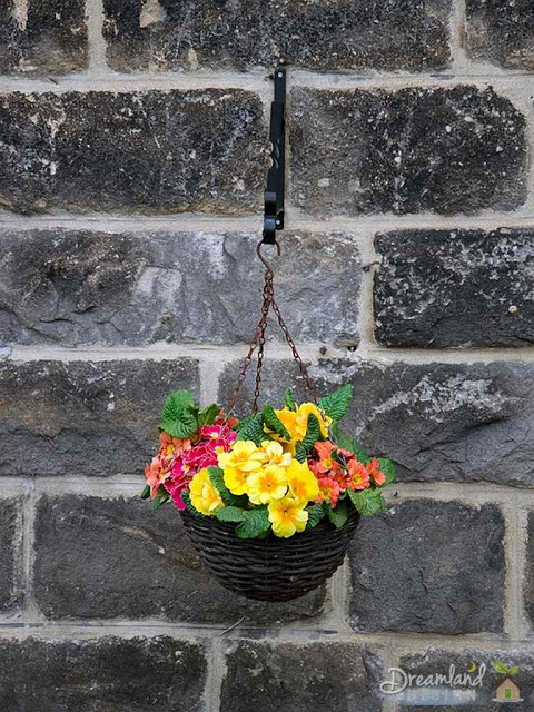 Any container such as this cauldren, can be used to create flower baskets